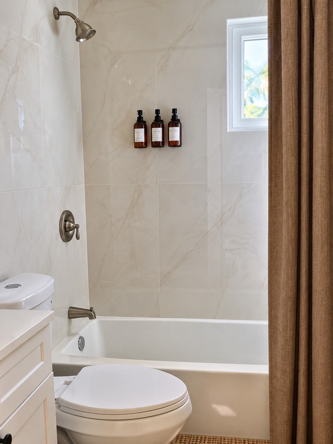 Bathroom with marble-look tile and tub