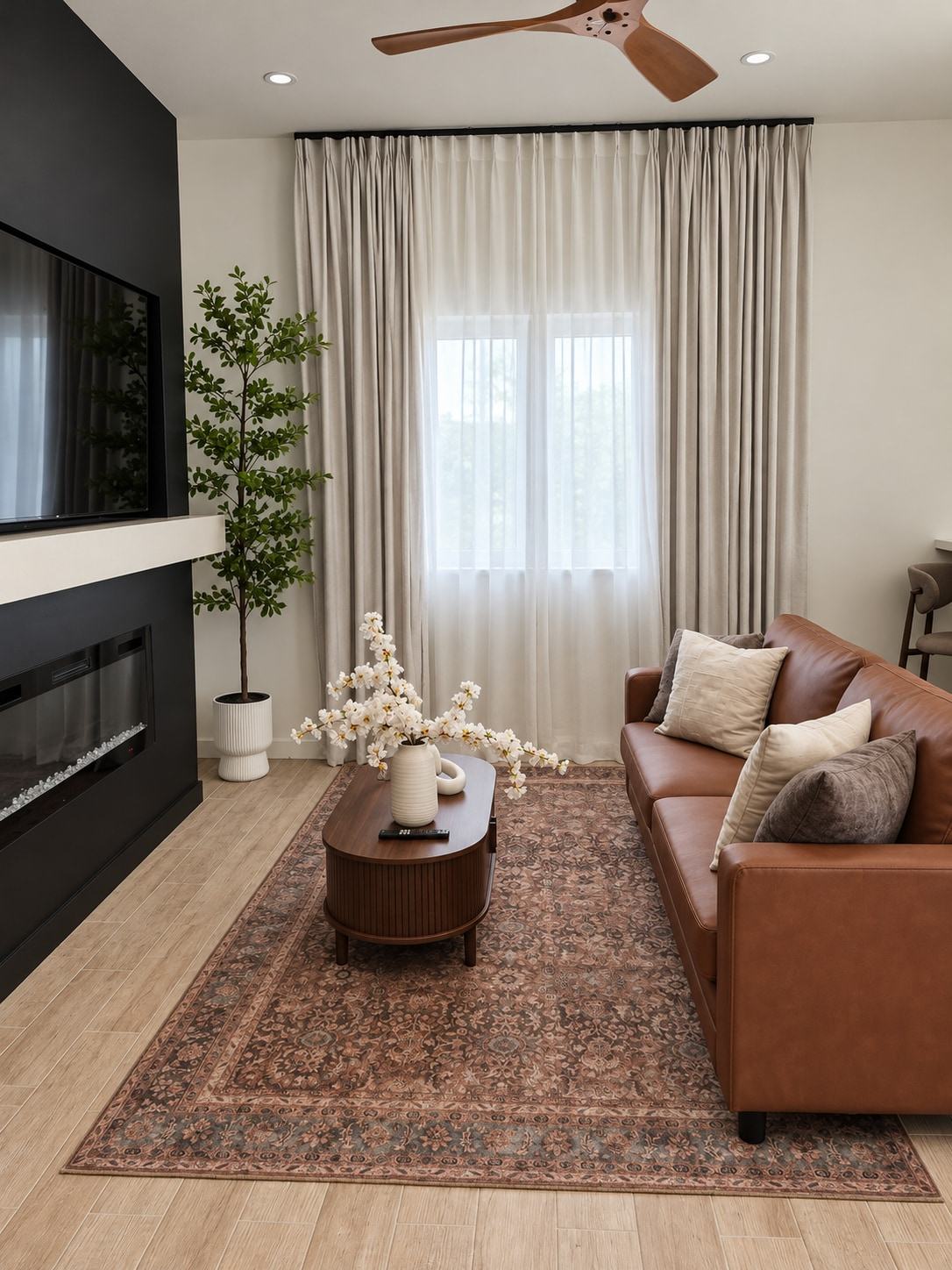 Living room with leather sofa and fireplace