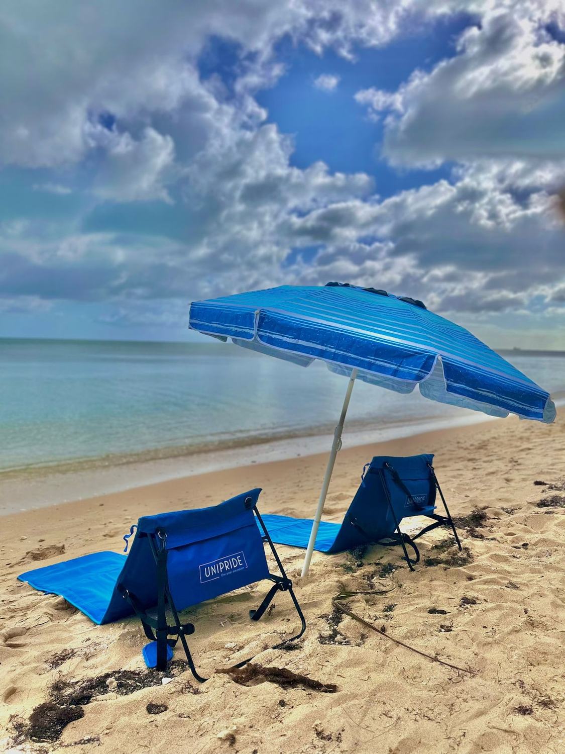 Beach chairs and umbrella on Coral Harbour beach