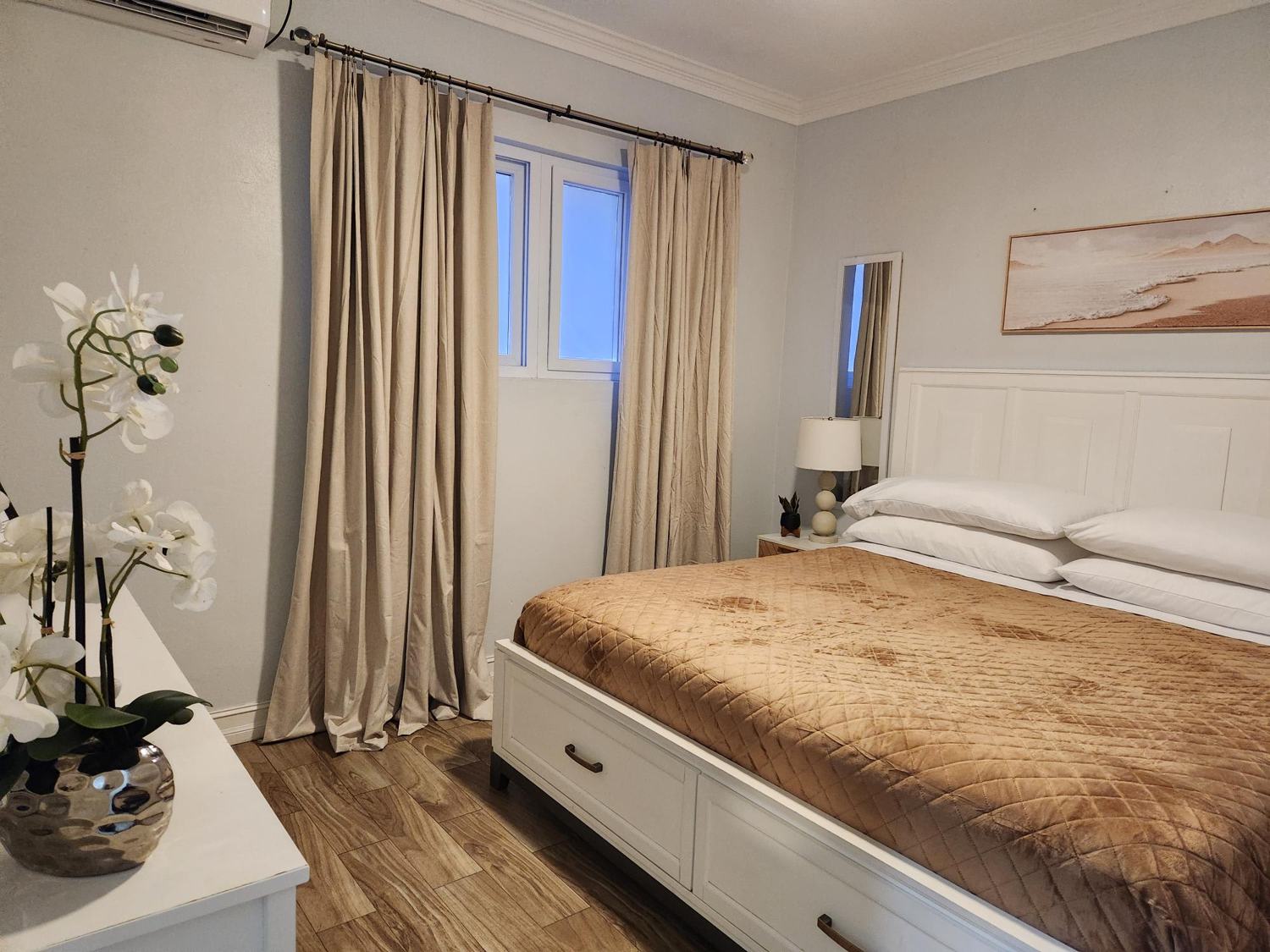 Bedroom with linen curtains and storage bed