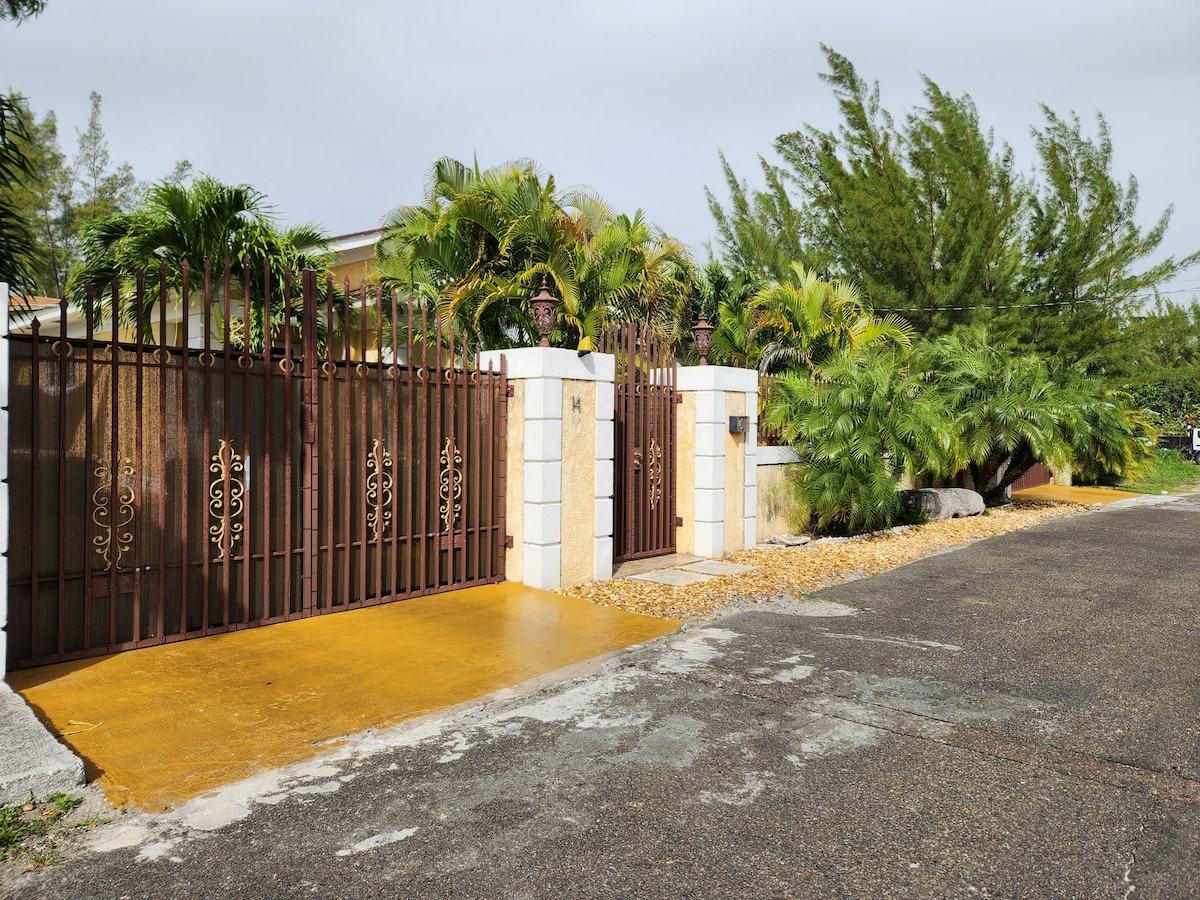 Gated entrance with palms