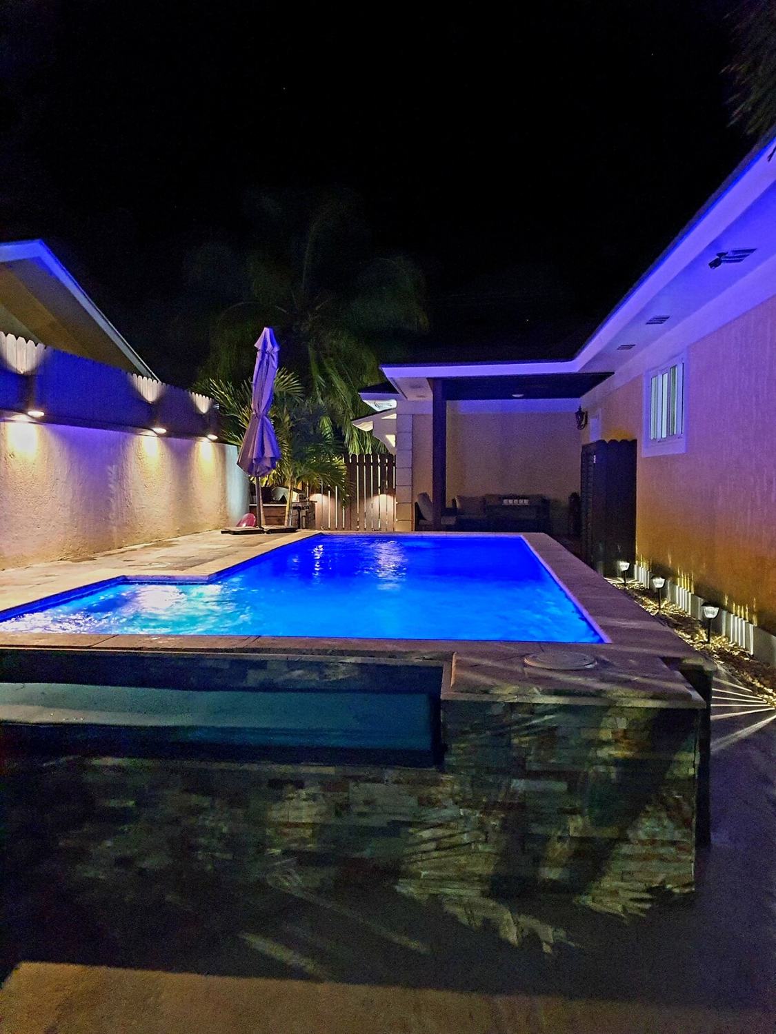 Pool lit blue at night
